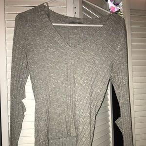 Grey long sleeve, open at elbows